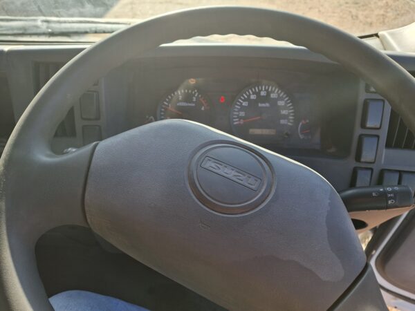 2010 Isuzu NPR400 dropside 4x2 with Palfinger PC2300A crane steering wheel